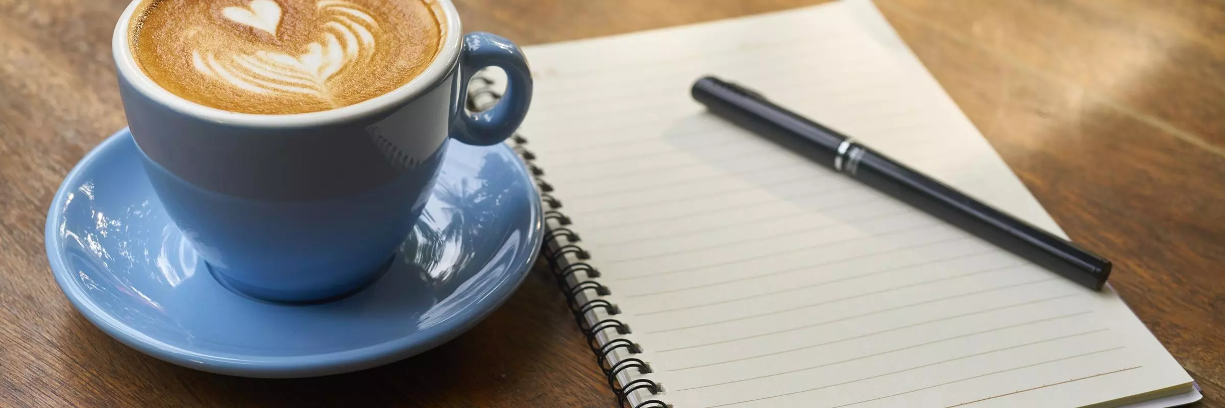 Writing notes and drinking coffee